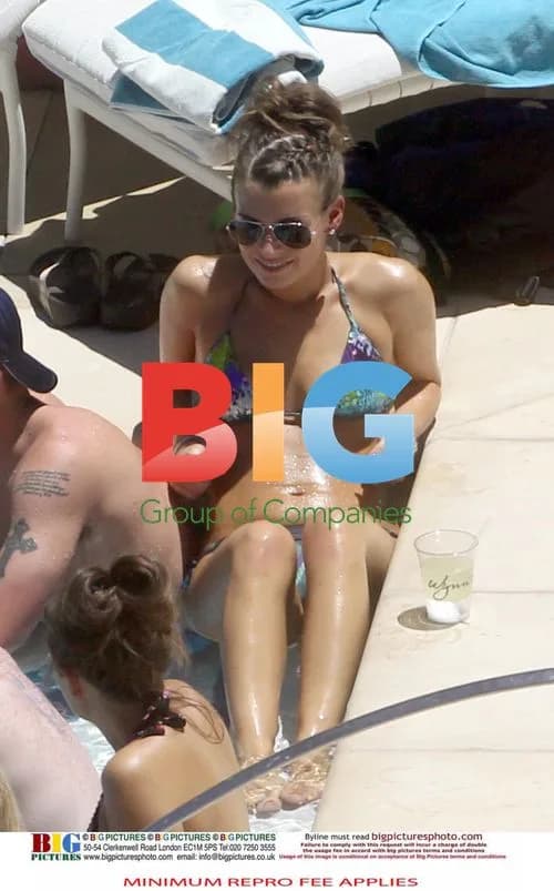 Rooney Relaxing Poolside in USA