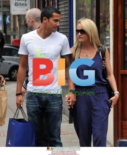 Everton Player Tim Cahill Shopping With Wife