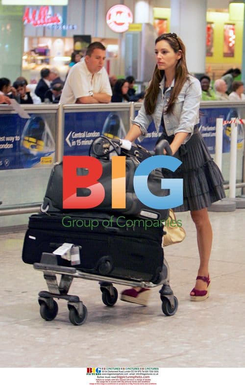 Kelly Brook Spotted at Airport in London