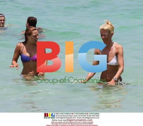 Michael Ballack on beach with injured leg