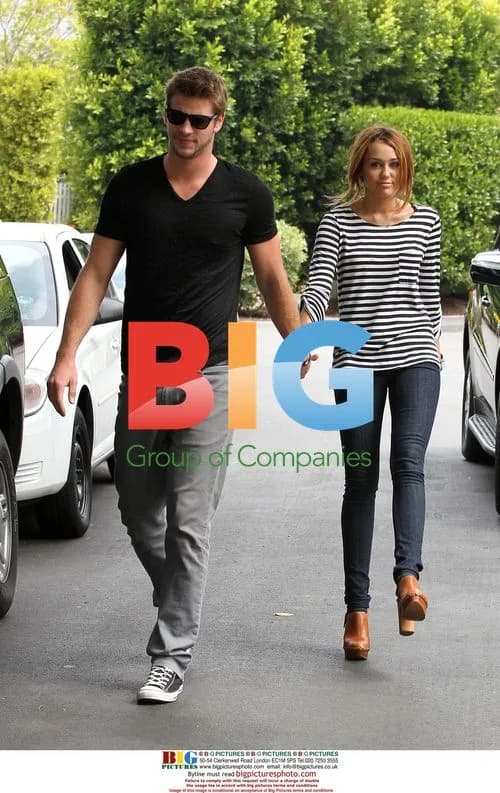 Miley Cyrus and Liam Hemsworth take a walk