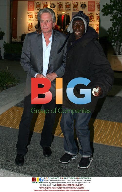 Michael Douglas Helps Homeless Man
