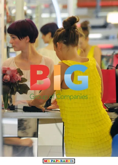 Coleen Rooney shopping in yellow dress