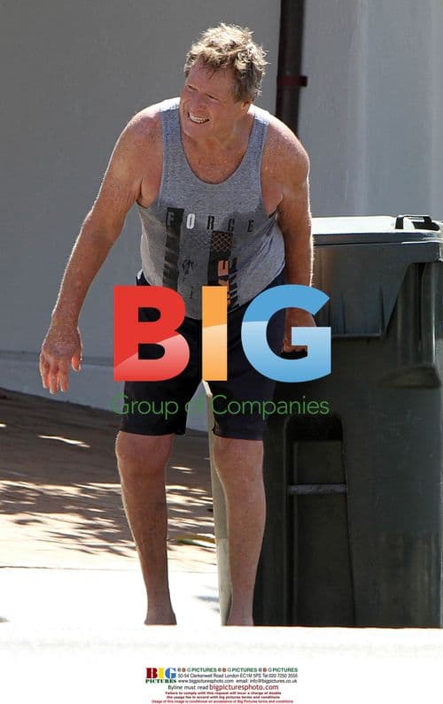 Ryan O'Neal Takes Out Trash