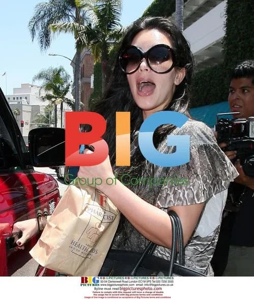 Kim Kardashian Escapes Paparazzi