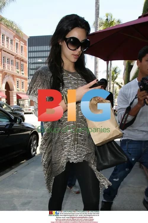 Kim Kardashian picked up by friend