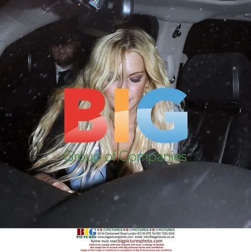 Lindsay Lohan Arrives at Voyeur Nightclub
