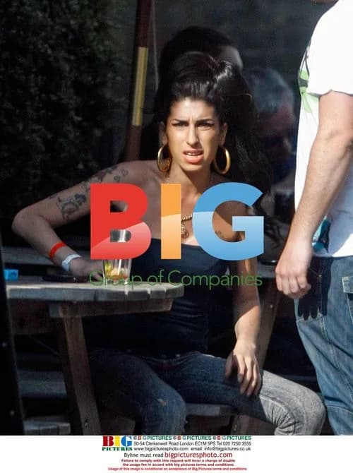 Amy Winehouse Playing with Boy at Pub
