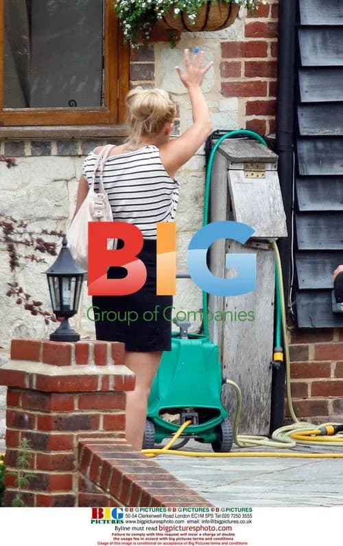 Kerry Katona Waves to Kids
