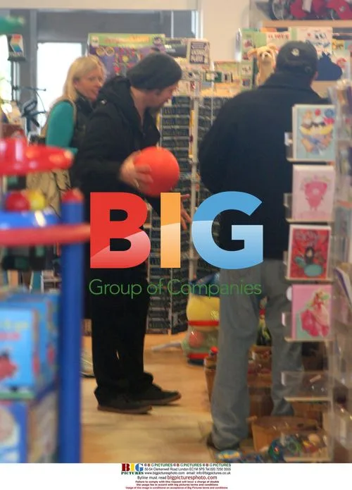 Brad Pitt Goofs Around at Toy Store
