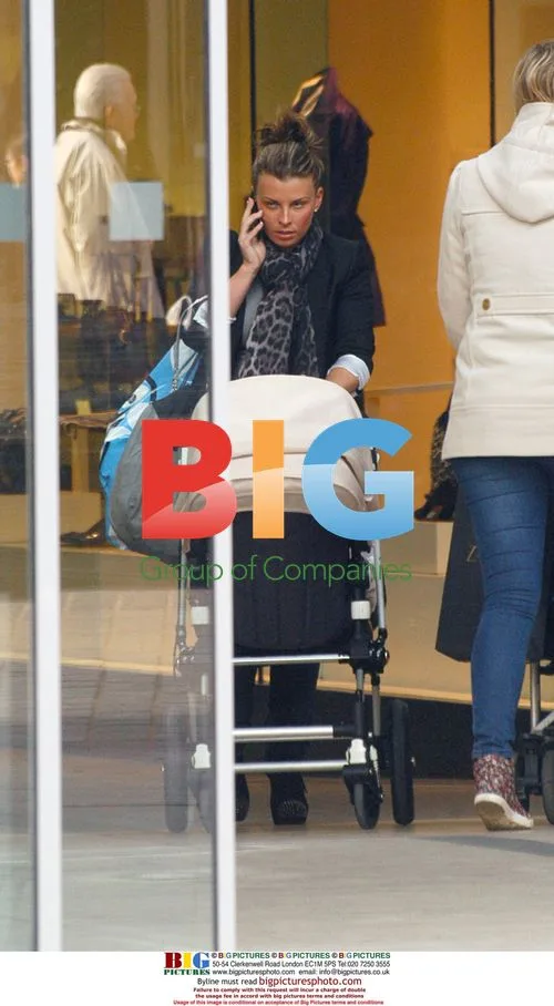 Coleen Rooney Out Shopping with Baby Kai