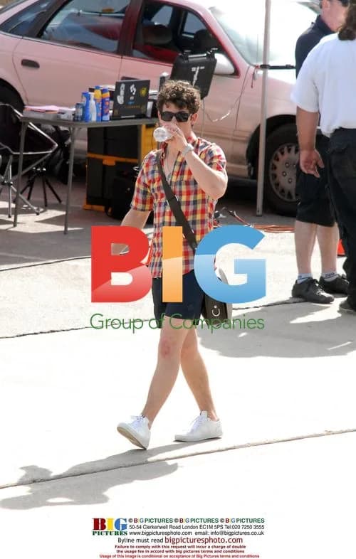 Nick Jonas Plays Catch on Set with Brothers