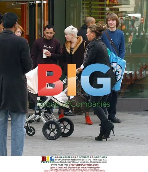 Coleen Rooney Out Shopping with Baby Kai