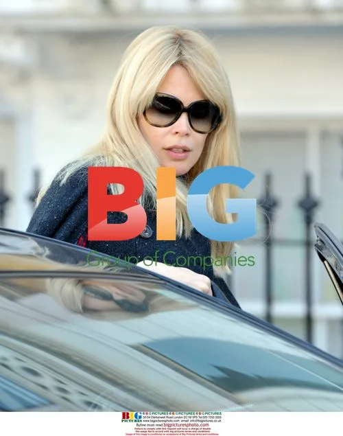 Claudia Schiffer drops kids off at school in London