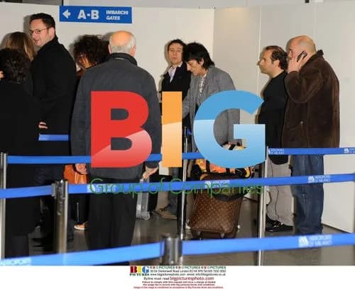 Ronnie Wood and girlfriend at Milan airport