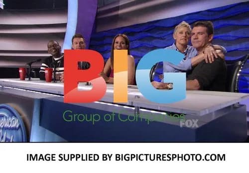 Ellen Degeneres Flirts with Simon Cowell on American Idol