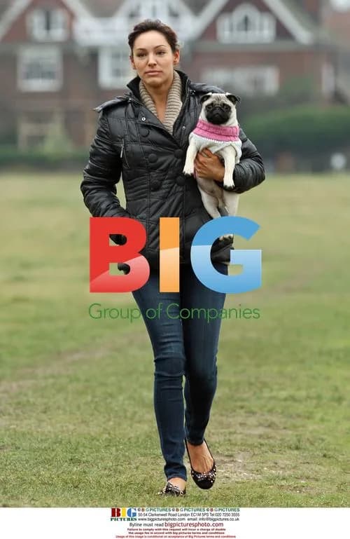 Kelly Brook walking dog in park