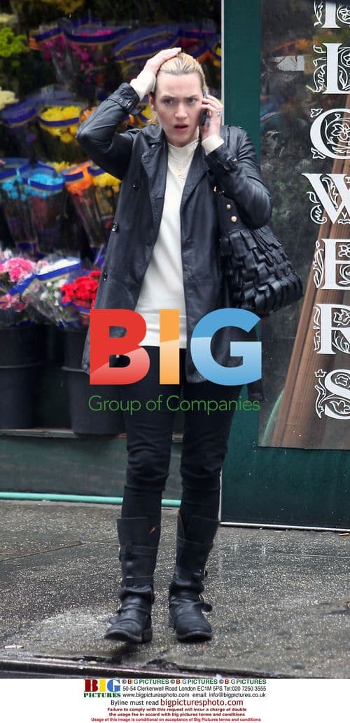 Kate Winslet Spotted Talking on Cell Phone in Rain