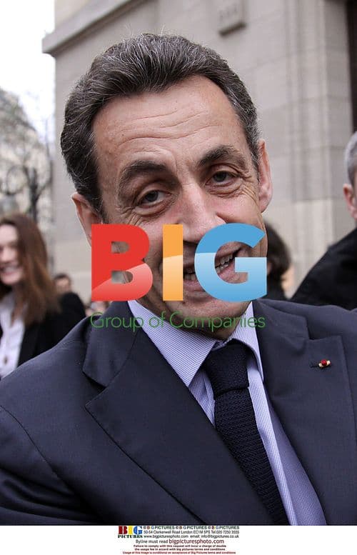 Sarkozy and Bruni vote hand in hand