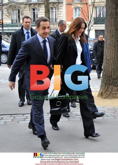 Sarkozy and Bruni vote hand in hand