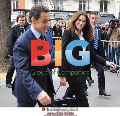 Sarkozy and Bruni Vote Hand-in-Hand