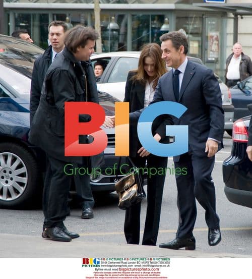 Sarkozy and Bruni vote hand-in-hand