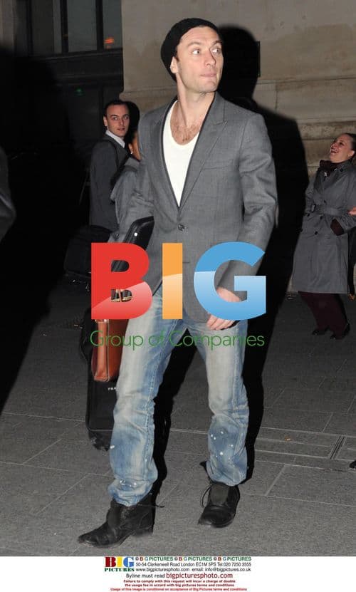 Jude Law Arrives in Paris