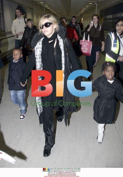 Madonna Arrives at Heathrow with Kids