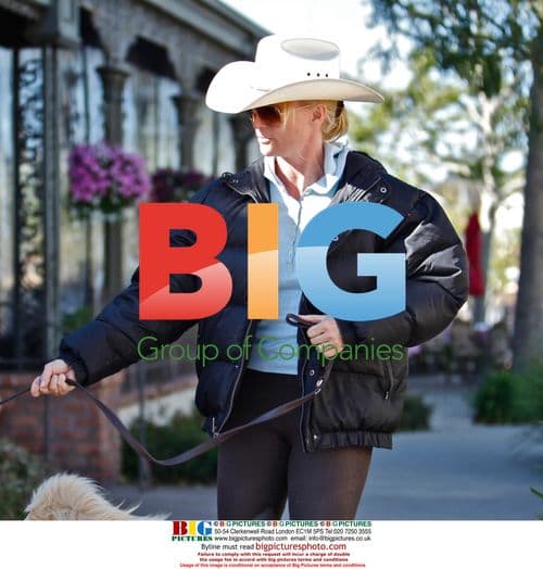 Nicollette Sheridan sports cowgirl hat and dog