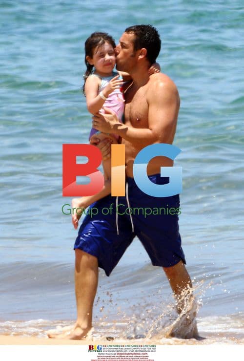 Adam Sandler plays with daughter on Maui beach