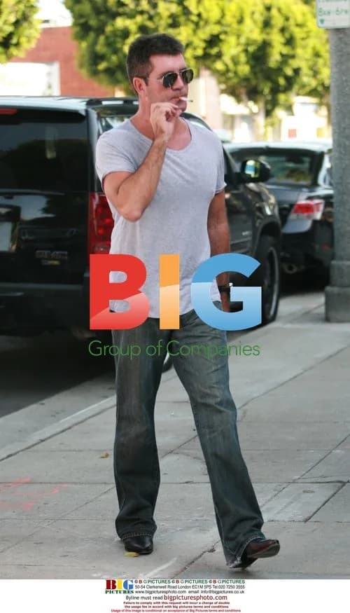 Simon Cowell and Mezhgan Hussainy shop for Ferrari