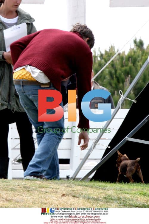Ashton Kutcher Playing Ball with Dog on Set