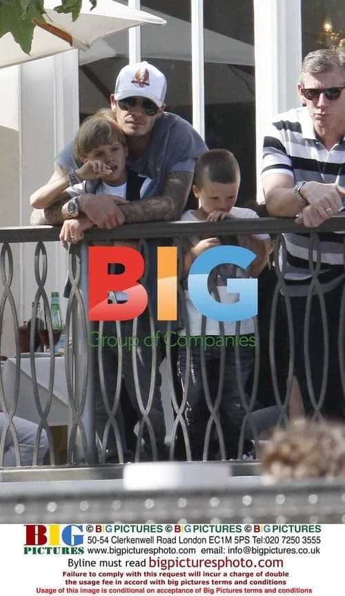 David and Victoria Beckham with sons at Jonas Brothers concert