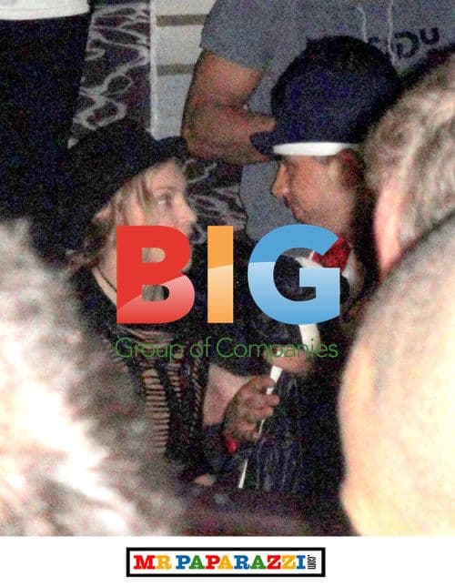 Madonna chats with friend at Aura club