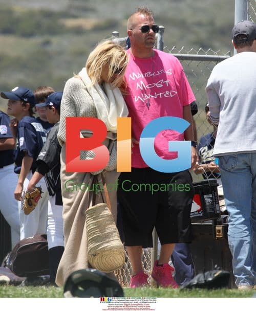 Pamela Anderson with boyfriend at baseball game