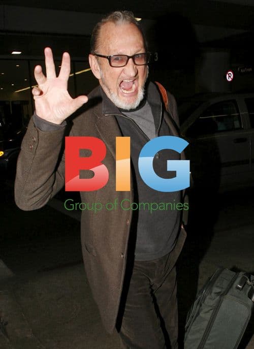 Robert Englund makes scary faces at LAX