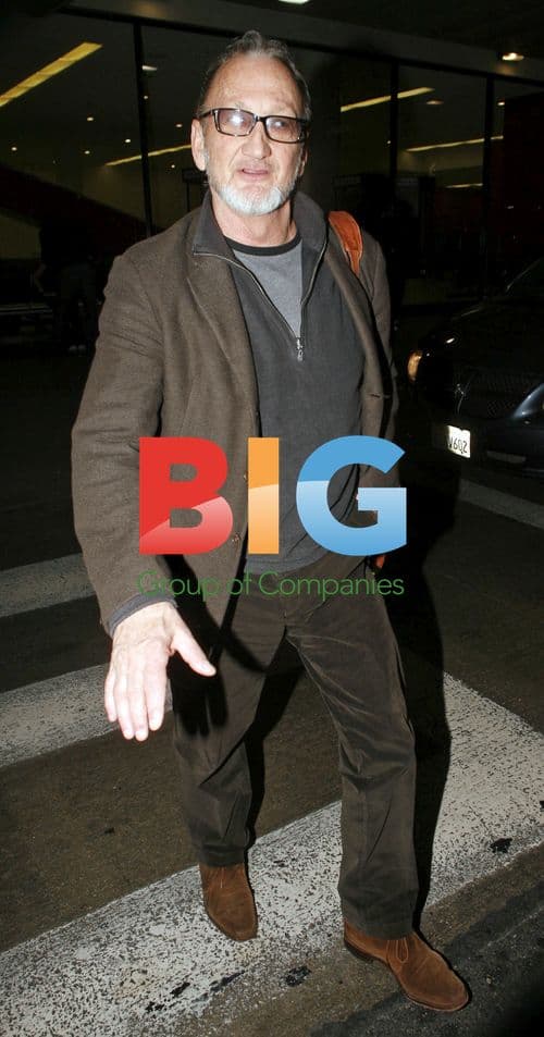 Robert Englund makes scary faces at LAX