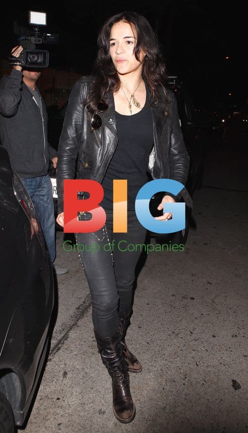 Michelle Rodriguez has a nose itch