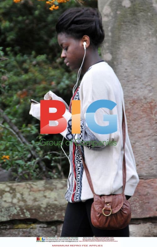 Gamu Nhengu listens to music at home