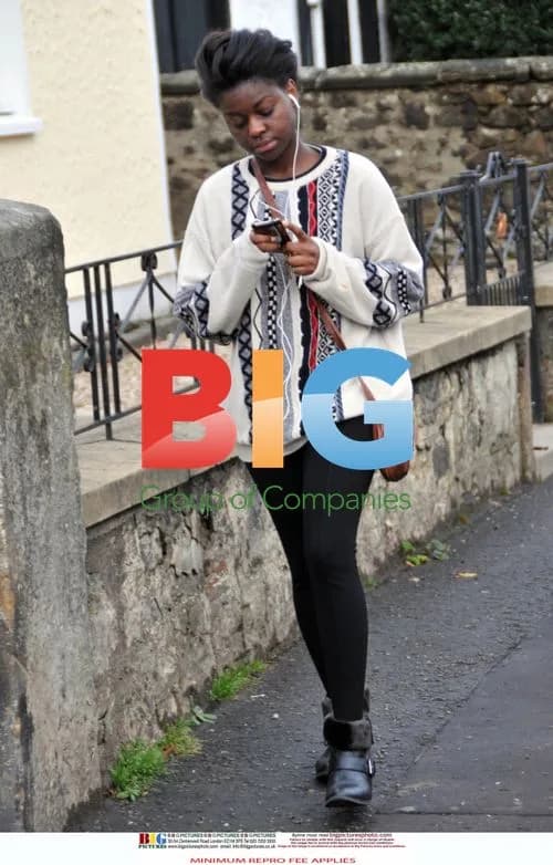 Gamu Nhengu Listens to Music at Home