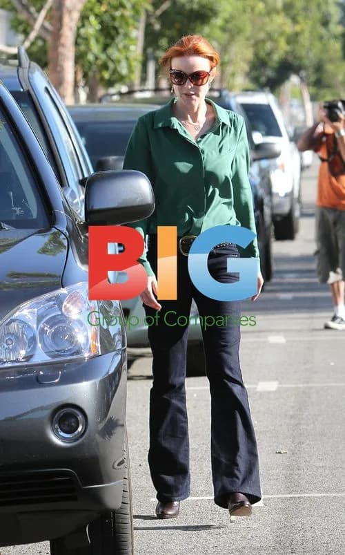 Marcia Cross picks up daughters from school