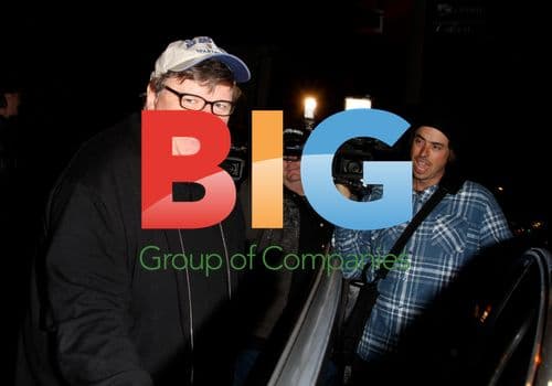 Michael Moore listens to activist