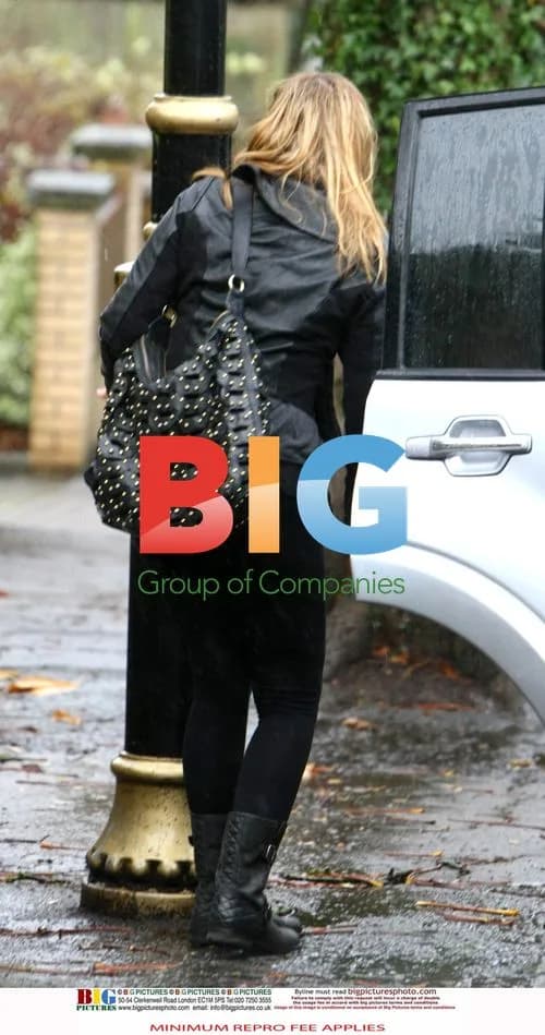 Charlotte Church with kids in the rain