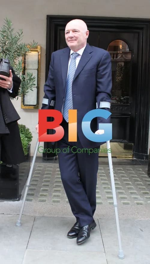 Peter Kenyon on Crutches in London
