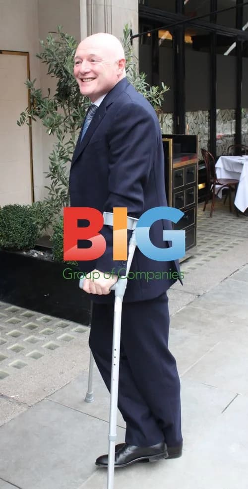 Peter Kenyon on Crutches in London