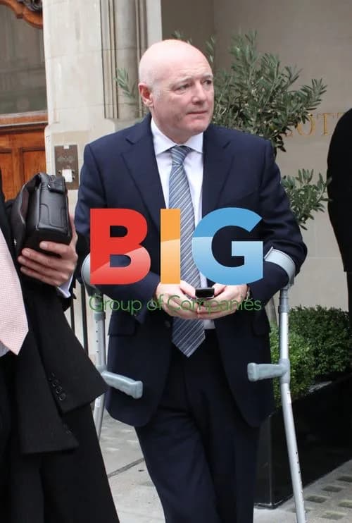 Peter Kenyon on Crutches in London
