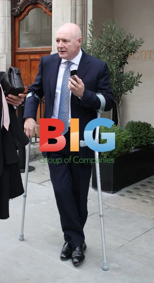 Peter Kenyon on Crutches