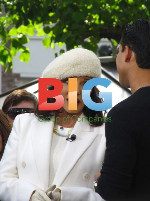 Joan Collins visits Mario Lopez at Extra