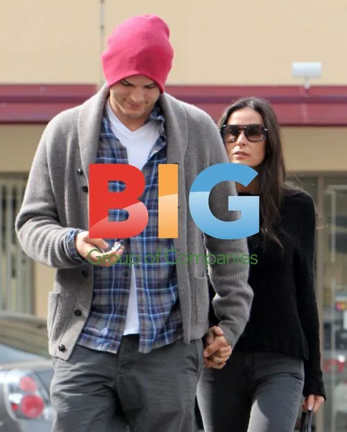 Ashton Kutcher Assists Demi Moore