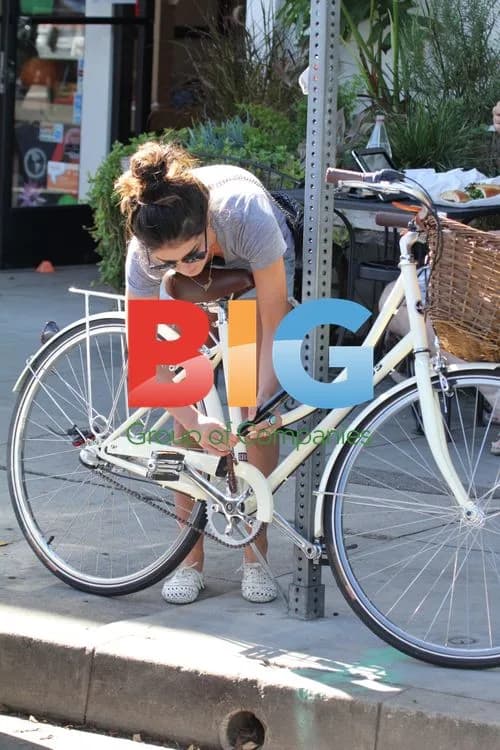 Shenae Grimes Locking Up Bike in LA